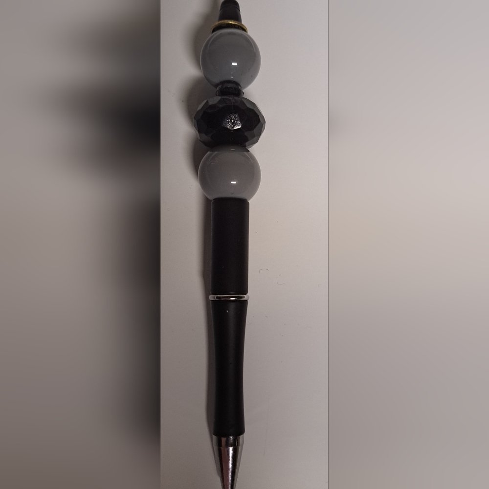 Black, gray,golden Asian coin pen